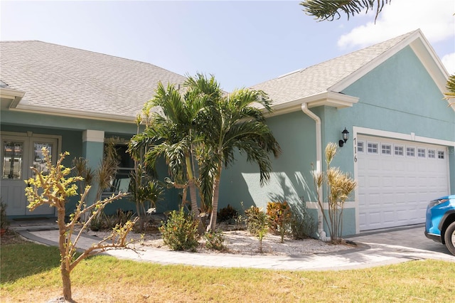 view of side of home featuring a garage