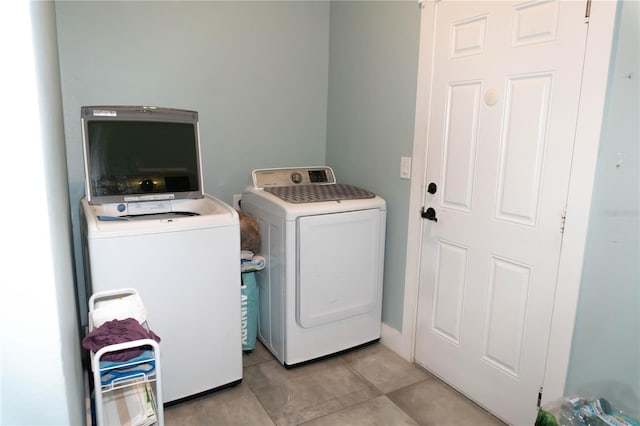 washroom with independent washer and dryer