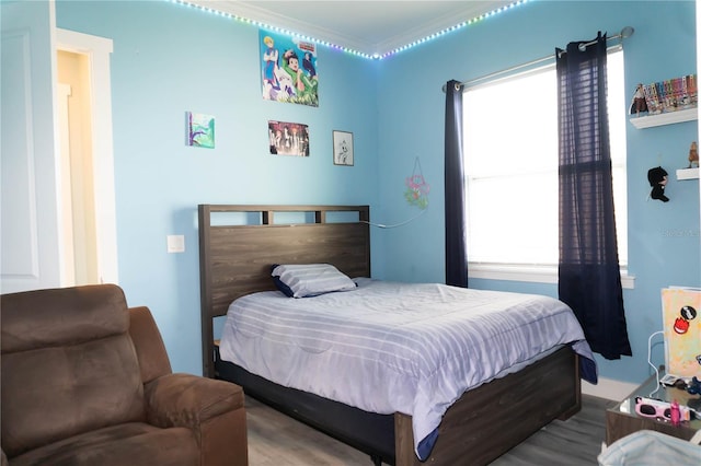 bedroom featuring crown molding