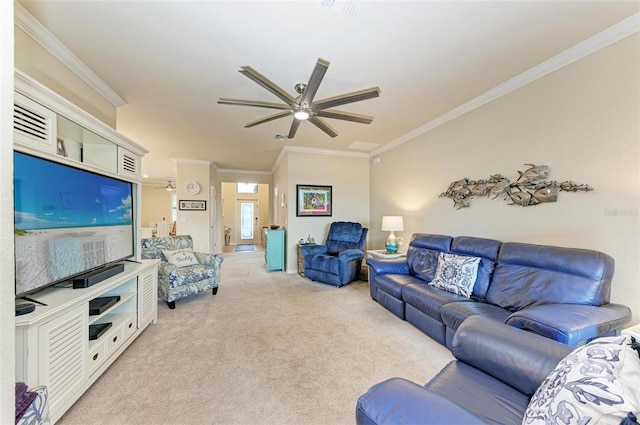 carpeted living room with ceiling fan and ornamental molding