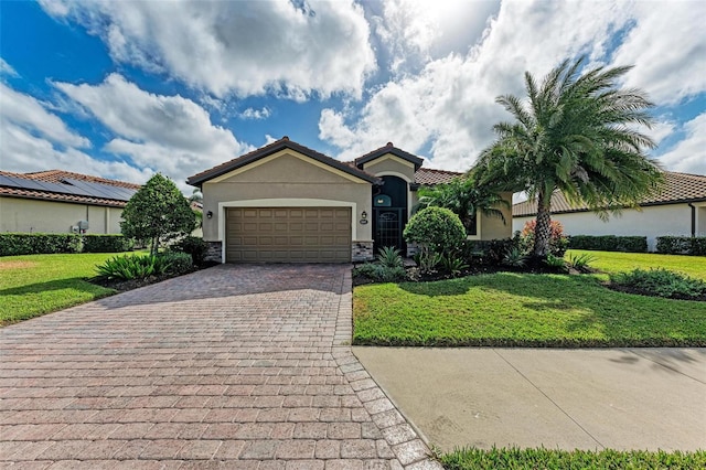 6547 Willowshire Way, Bradenton, FL 34212 - view of front of home with stucco siding, decorative driveway, a front yard, a garage, and a tiled roof