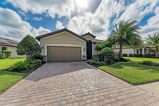 6547 Willowshire Way, Bradenton, FL 34212 - ranch-style house with stucco siding, decorative driveway, a front lawn, and stone siding