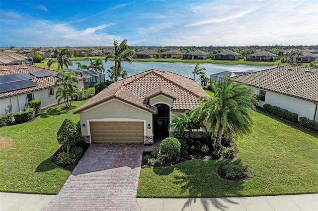 6547 Willowshire Way, Bradenton, FL 34212 - view of front facade with a residential view, an attached garage, a water view, a tile roof, and stucco siding