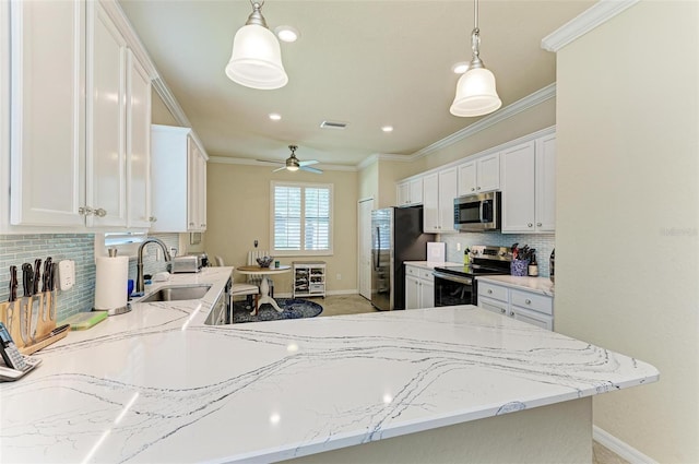 6547 Willowshire Way, Bradenton, FL 34212 - kitchen featuring appliances with stainless steel finishes, baseboards, a sink, tasteful backsplash, and ornamental molding