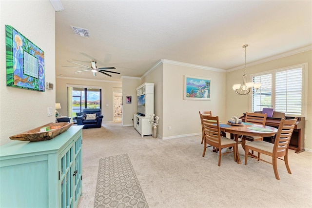6547 Willowshire Way, Bradenton, FL 34212 - dining room with light carpet, healthy amount of natural light, a chandelier, ornamental molding, and a ceiling fan
