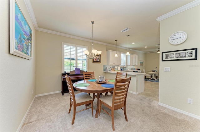 6547 Willowshire Way, Bradenton, FL 34212 - dining space featuring ornamental molding, light carpet, plenty of natural light, and a chandelier