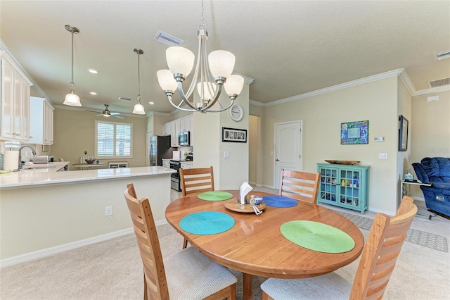 6547 Willowshire Way, Bradenton, FL 34212 - dining room featuring ceiling fan, crown molding, a chandelier, baseboards, and light colored carpet