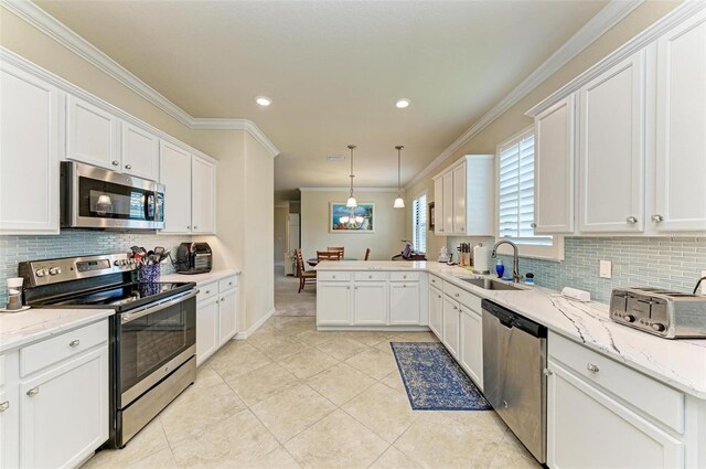 6547 Willowshire Way, Bradenton, FL 34212 - kitchen with appliances with stainless steel finishes, a sink, backsplash, ornamental molding, and white cabinets