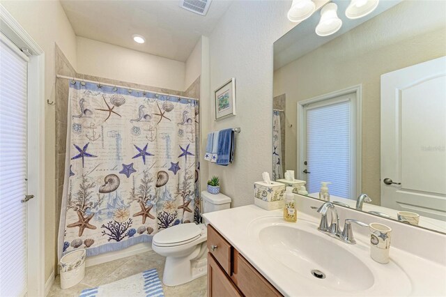 6547 Willowshire Way, Bradenton, FL 34212 - bathroom featuring toilet, tile patterned flooring, vanity, and a shower with shower curtain