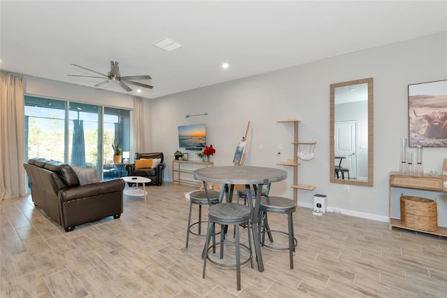 dining area featuring light hardwood / wood-style flooring and ceiling fan