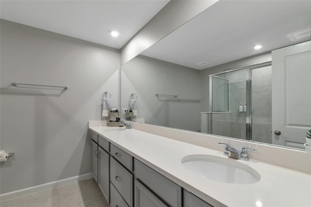 bathroom featuring vanity, tile patterned flooring, and walk in shower