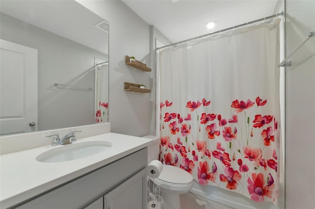 full bathroom with toilet, vanity, and shower / bath combination with curtain