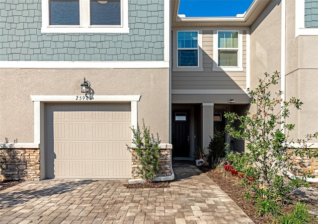 property entrance with a garage