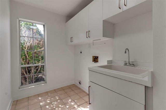 2303 89th St NW, Bradenton, FL 34209 - laundry room featuring hookup for an electric dryer, cabinet space, washer hookup, light tile patterned flooring, and baseboards