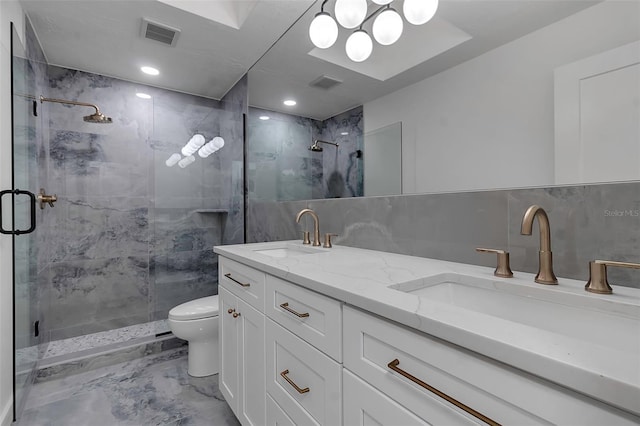 bathroom with toilet, backsplash, tile walls, vanity, and walk in shower