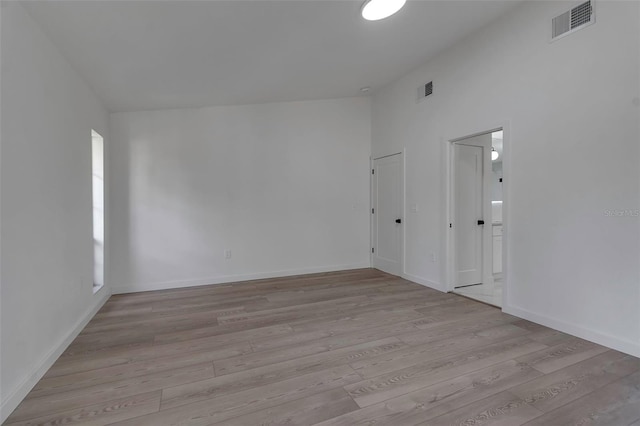 spare room featuring light hardwood / wood-style flooring