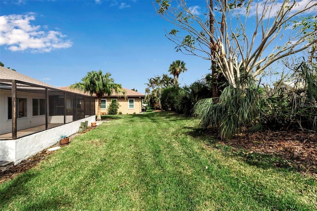 2303 89th St NW, Bradenton, FL 34209 - view of grassy yard with a lanai