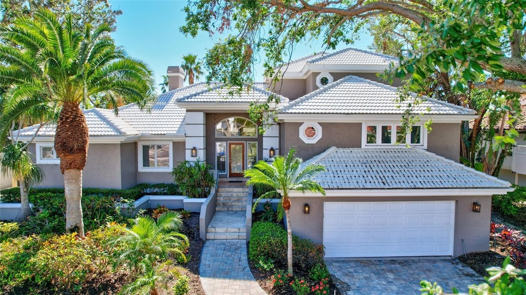 mediterranean / spanish-style house featuring a garage