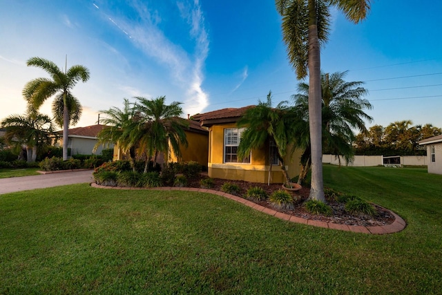 view of front of property with a yard