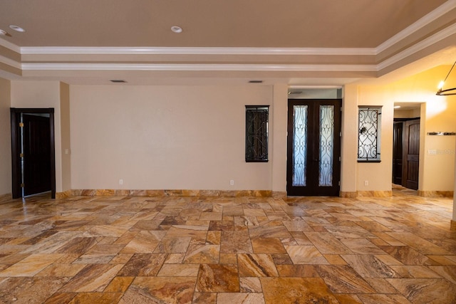 spare room with french doors, crown molding, and a tray ceiling