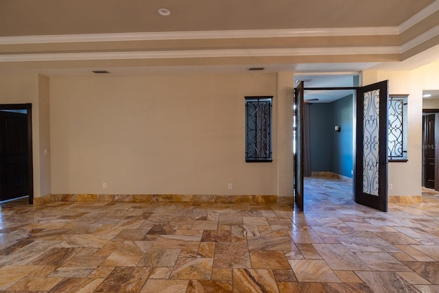 unfurnished room featuring crown molding