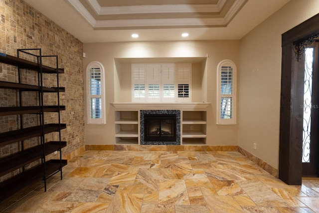 living room featuring ornamental molding and a raised ceiling