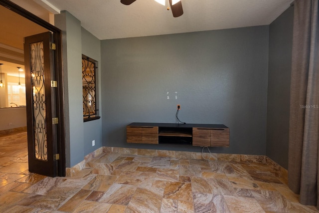 empty room featuring ceiling fan