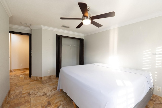 bedroom featuring ceiling fan, a closet, and crown molding