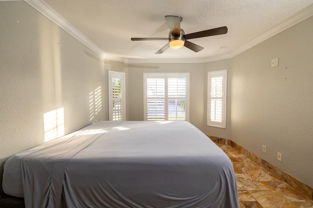 bedroom with a textured ceiling, ceiling fan, and crown molding