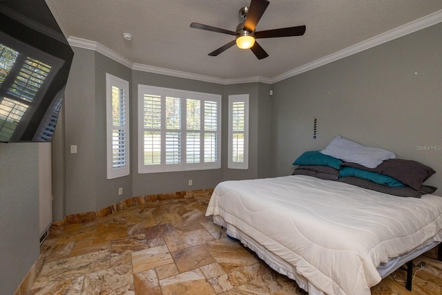 bedroom with ornamental molding and ceiling fan