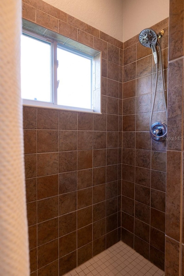 bathroom with tiled shower