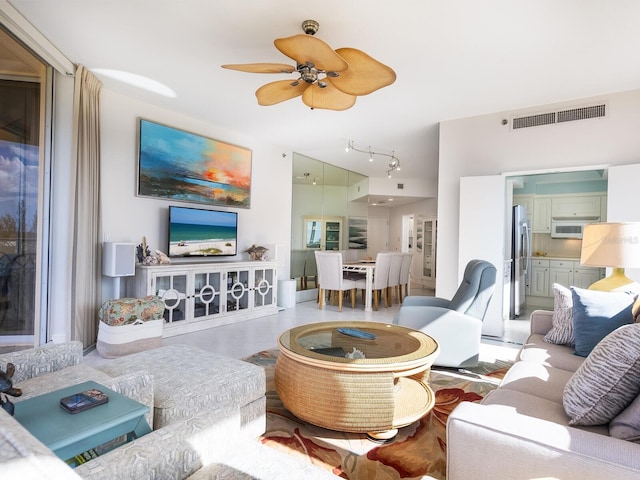 living room featuring ceiling fan