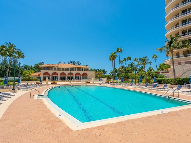 view of swimming pool with a patio