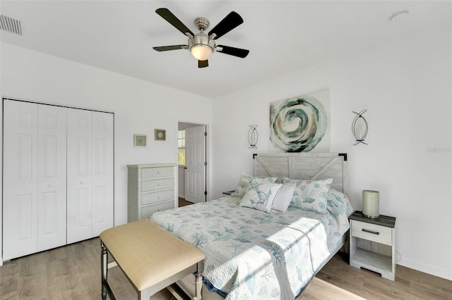 bedroom featuring a closet, hardwood / wood-style flooring, and ceiling fan