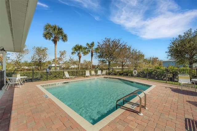 view of swimming pool with a patio area