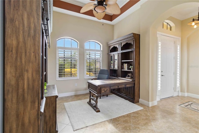 tiled office space with ceiling fan and crown molding