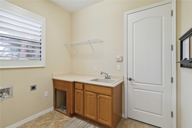 washroom with hookup for a washing machine, electric dryer hookup, sink, and light tile patterned floors