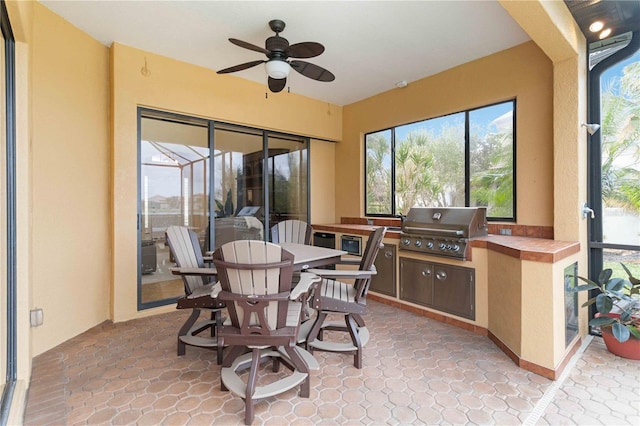 sunroom / solarium with ceiling fan