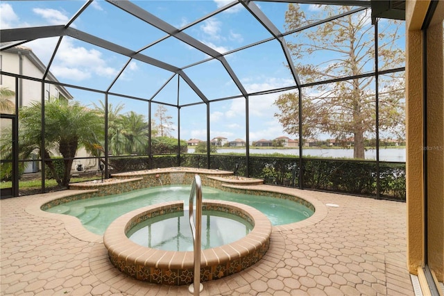 view of pool featuring a lanai, a water view, a patio, and an in ground hot tub