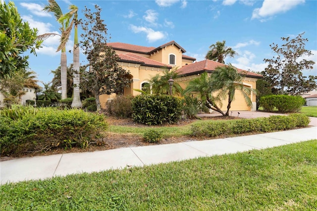 view of property exterior with a garage and a yard