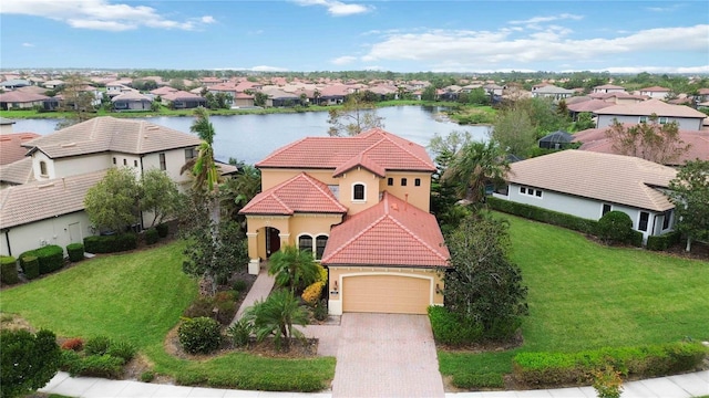 birds eye view of property with a water view