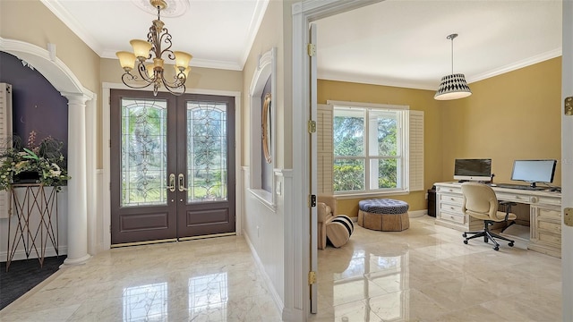 interior space with french doors, crown molding, decorative columns, and an inviting chandelier