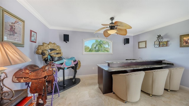 office space with ceiling fan and ornamental molding