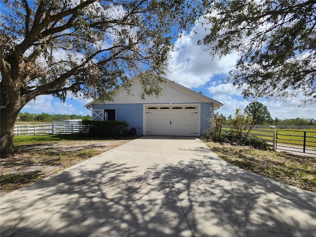 view of side of home with a rural view