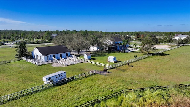 birds eye view of property with a rural view