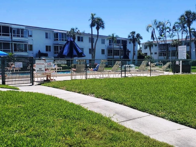 view of community featuring a yard