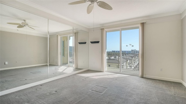 empty room with crown molding, carpet floors, and ceiling fan