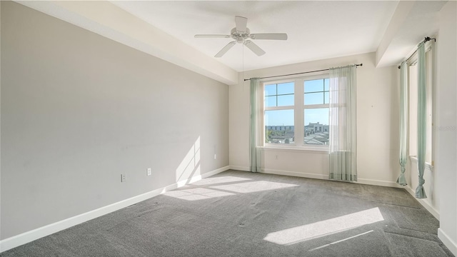 carpeted empty room featuring ceiling fan