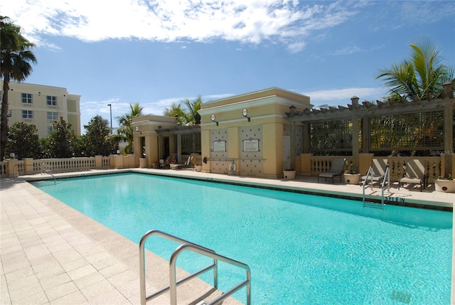 view of swimming pool featuring a pergola and a patio area