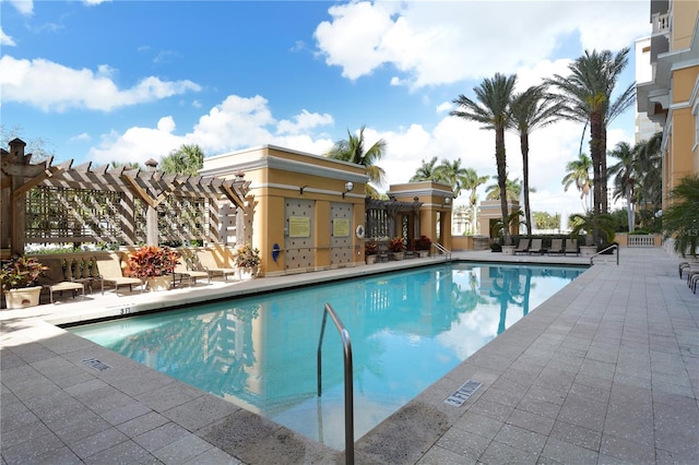 view of swimming pool with a patio area and a pergola